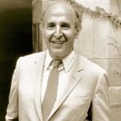 Bloom in suit smiling